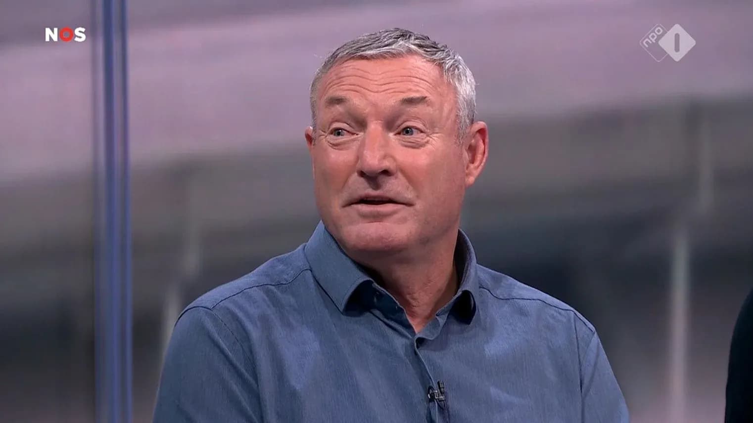 Sports analyst speaking during a broadcast segment