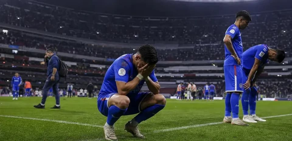 Cruz Azul players reacting after match loss on field
