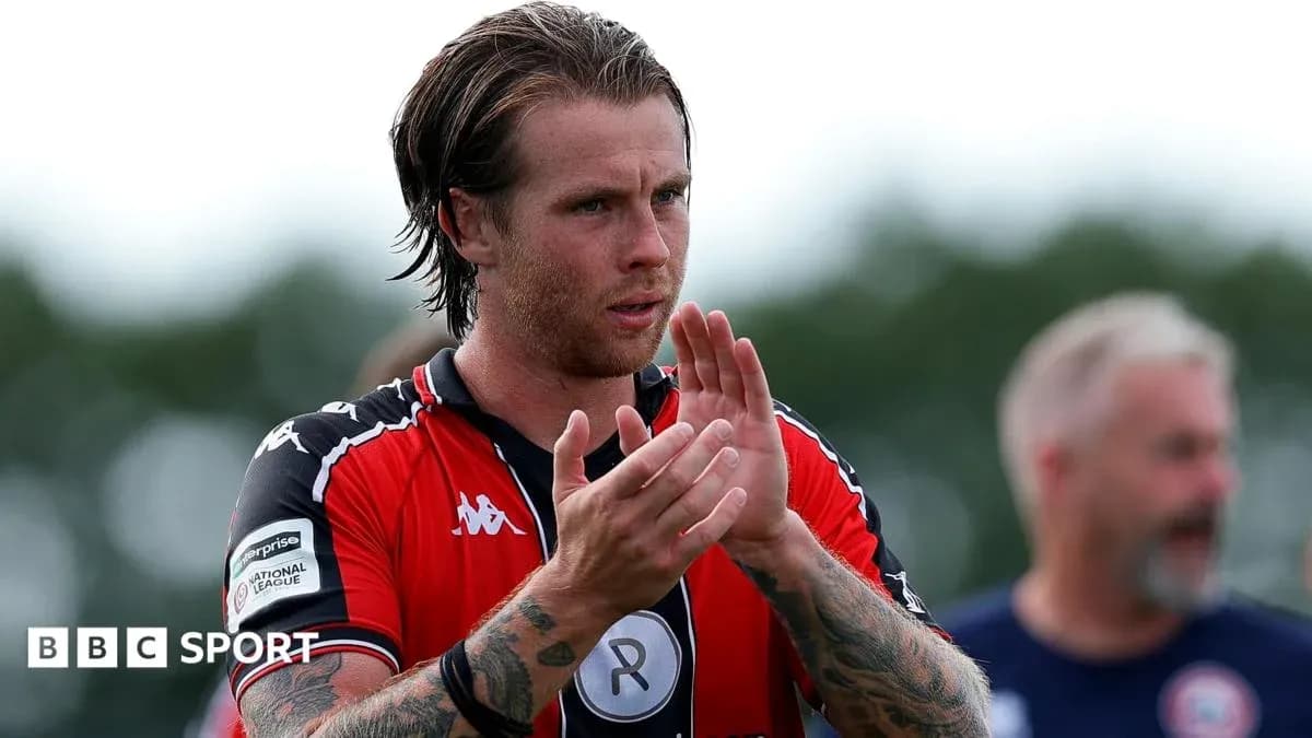 Player applauding fans after the match