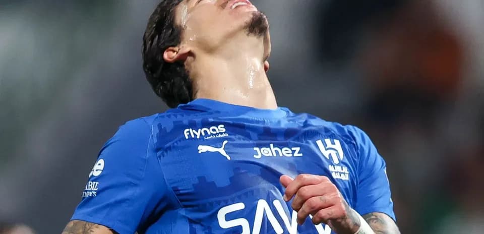 Player in blue jersey looking up during match