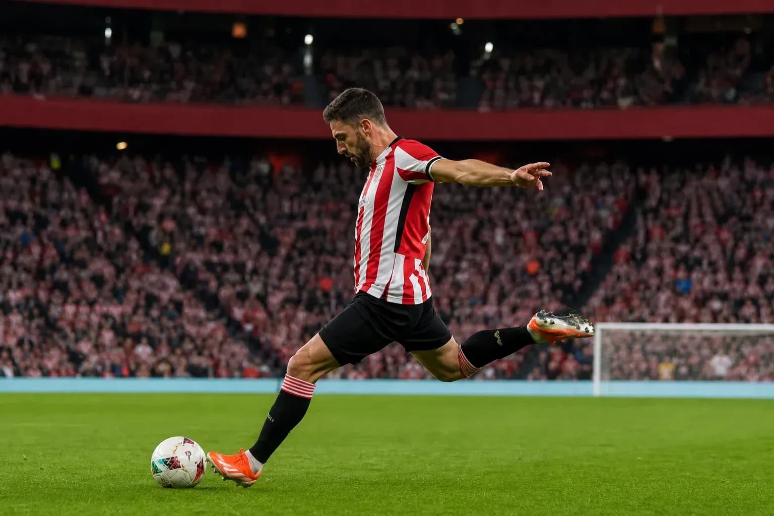 Player kicking ball during a football match