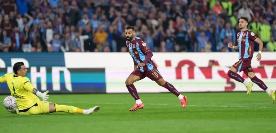 Player scoring against goalkeeper during match