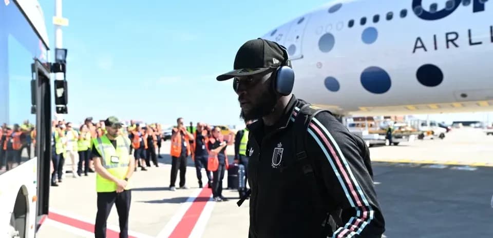 Player arriving at airport near airplane