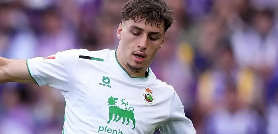 Player in white kit during match action
