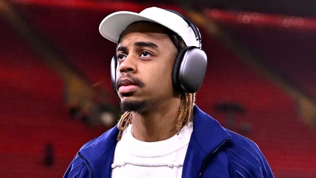 Player wearing headphones walking on the pitch
