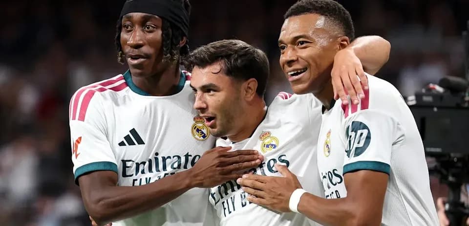Real Madrid players celebrating a goal together