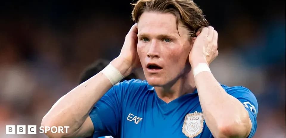 Player in blue jersey with hands on head
