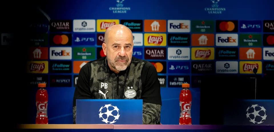 Manager at Champions League press conference podium