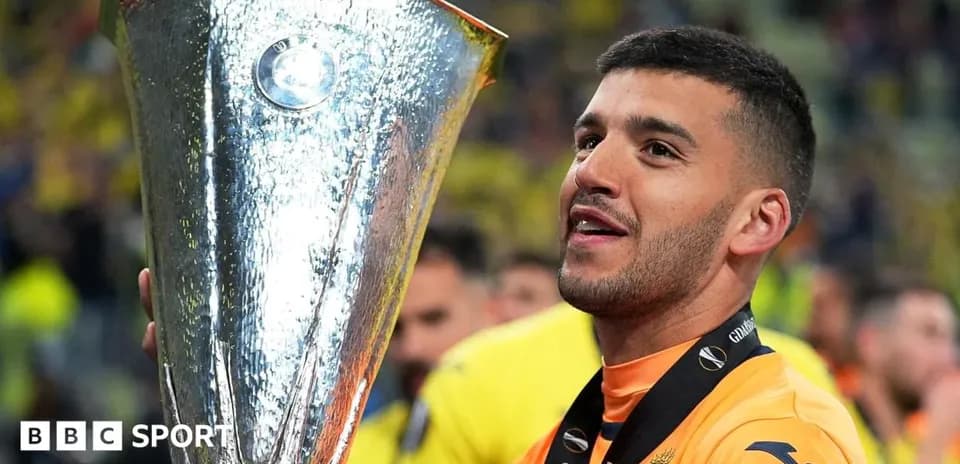 Player holding UEFA Europa League trophy after victory