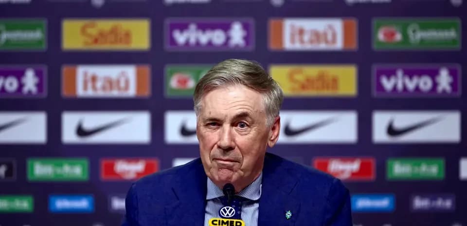 Manager speaking at press conference with sponsor backdrop