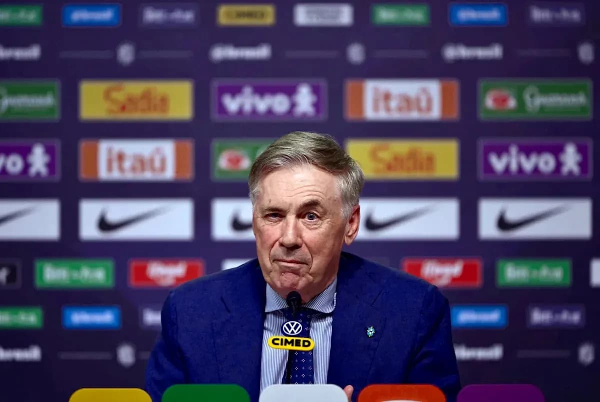 Manager speaking at press conference with sponsor backdrop