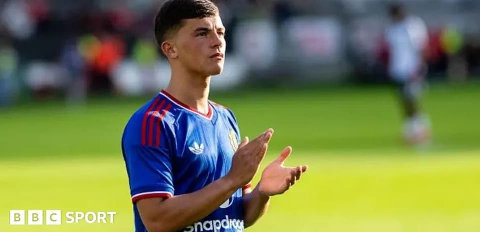 Player applauding fans on the pitch during match