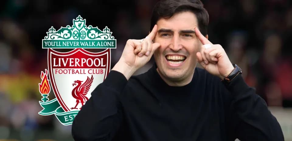 Man gesturing with Liverpool FC logo in background