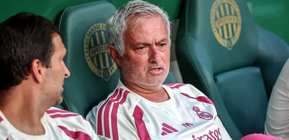Coach discussing strategy on the bench during match