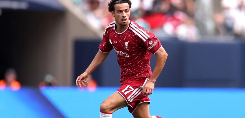 Player in Liverpool kit running during match