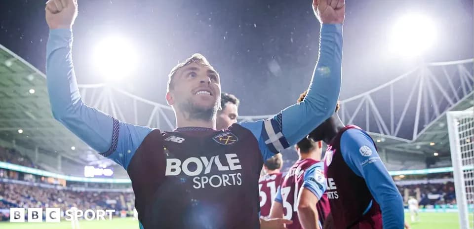 Player celebrating a goal with raised arms