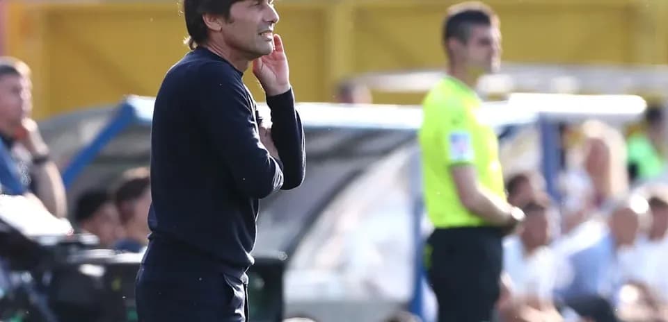 Coach giving instructions during a match on the sidelines