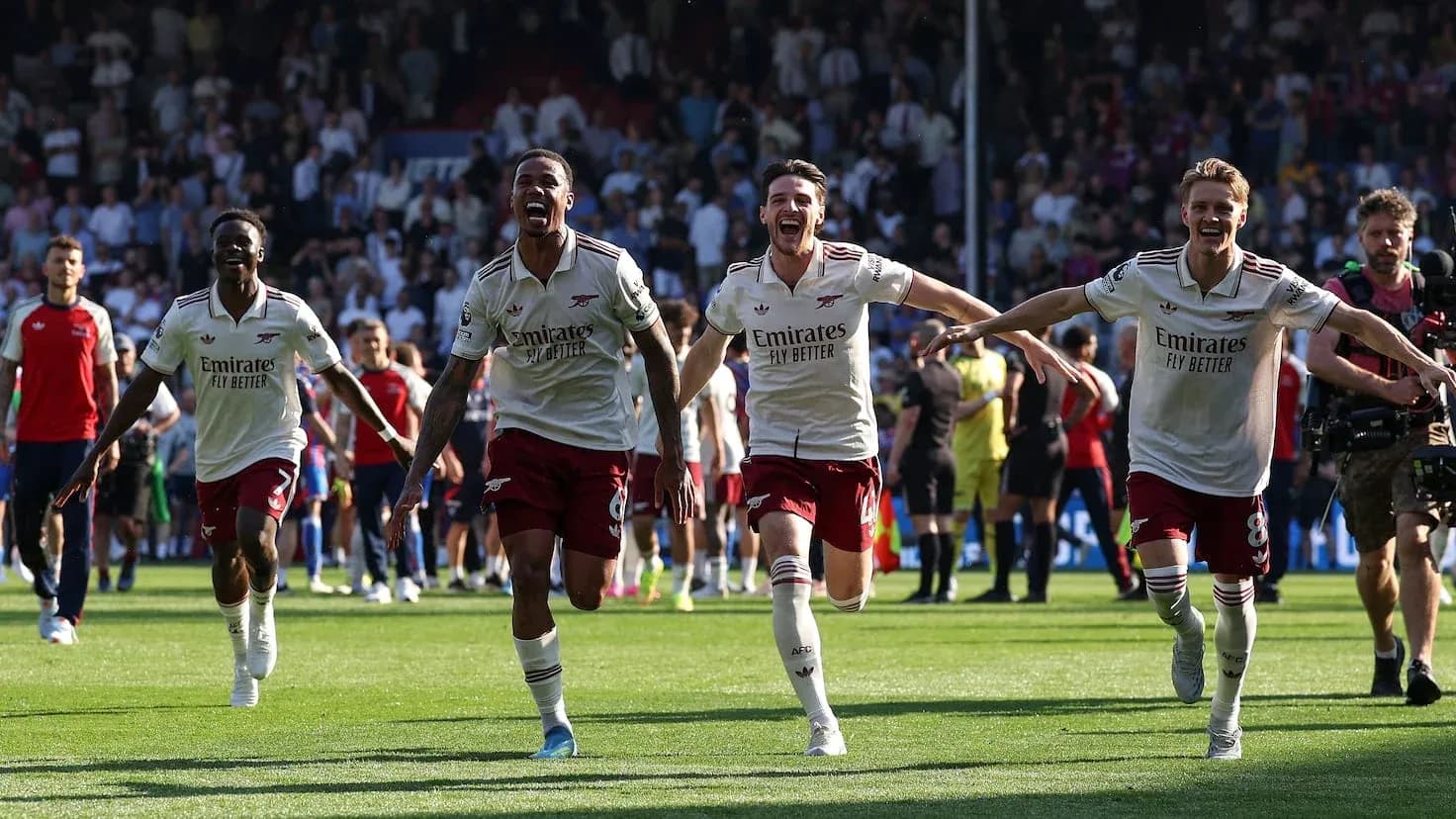 Arsenal players celebrating victory on the pitch