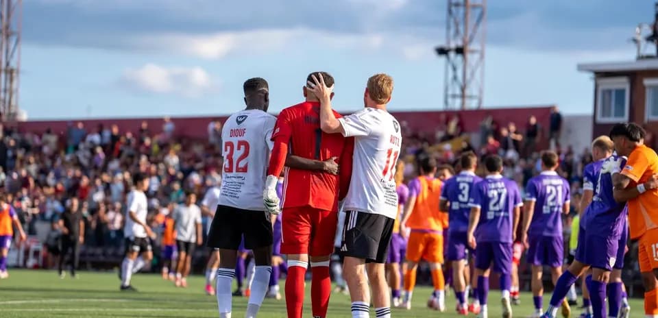 Players celebrating after USL League One match