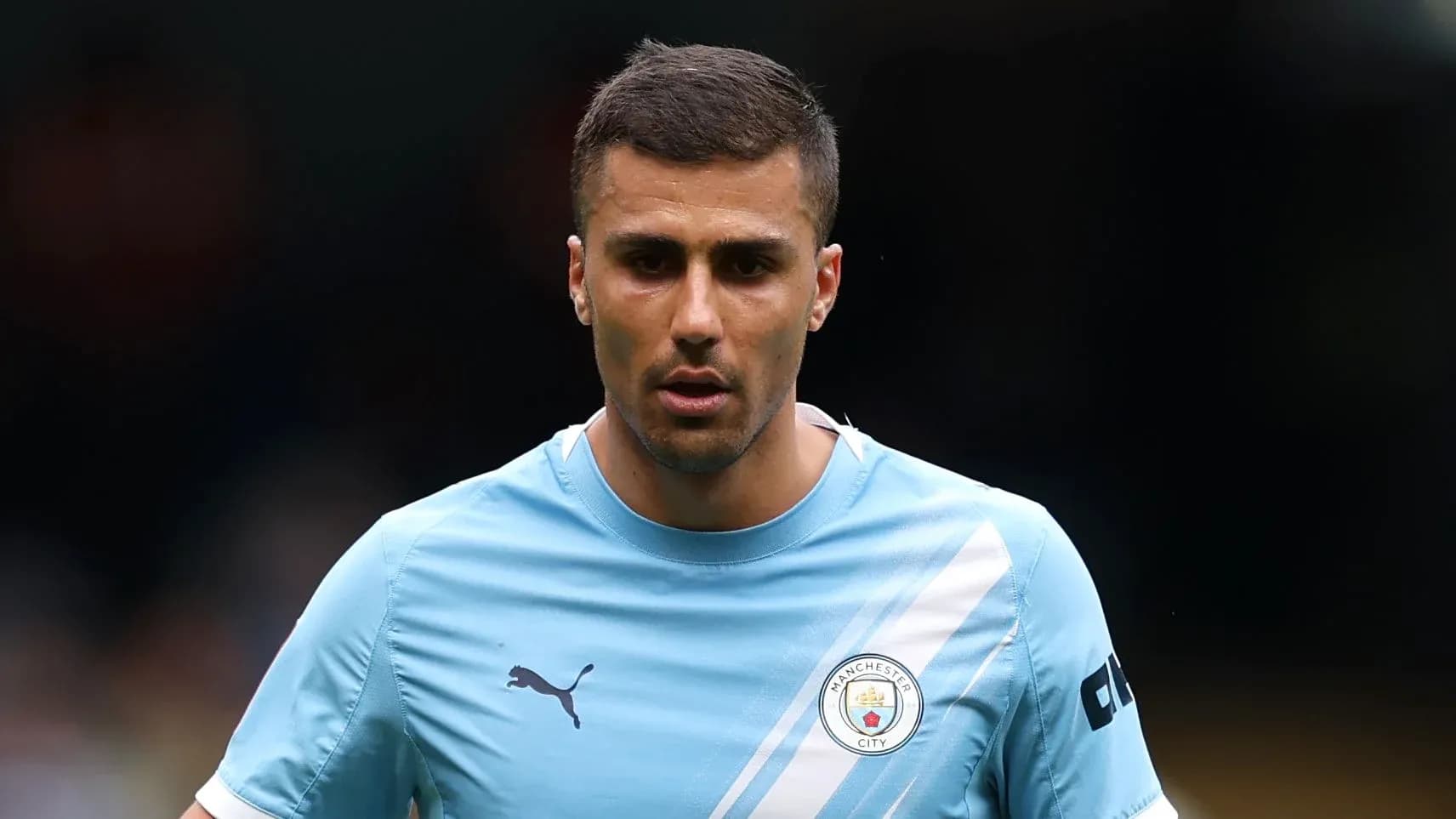 Player in Manchester City training kit on field