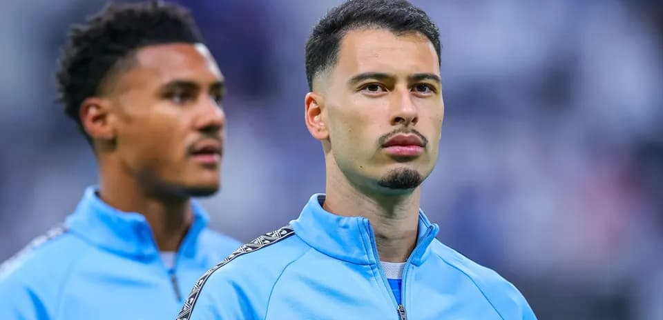Two players in Marseille training jackets before match