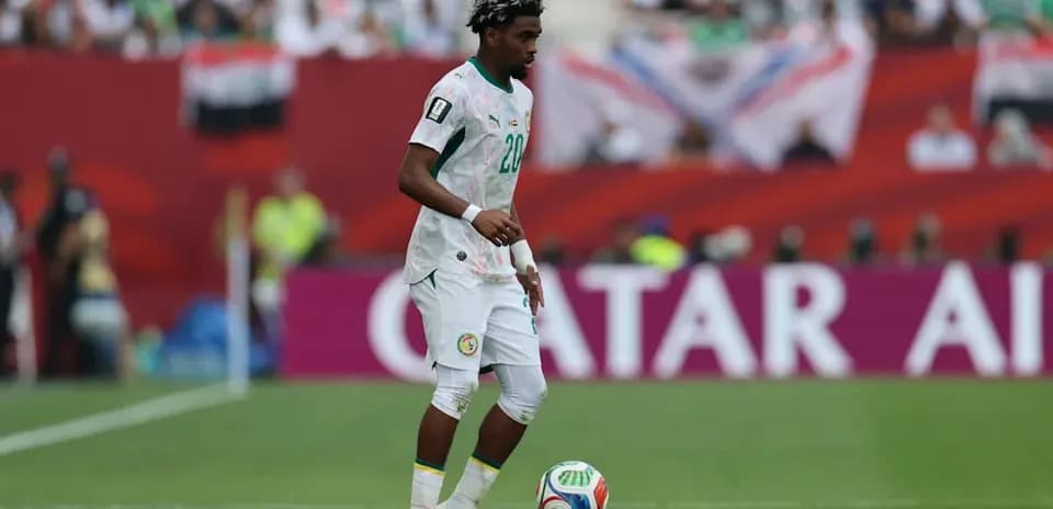 Player from Senegal controlling the ball on field
