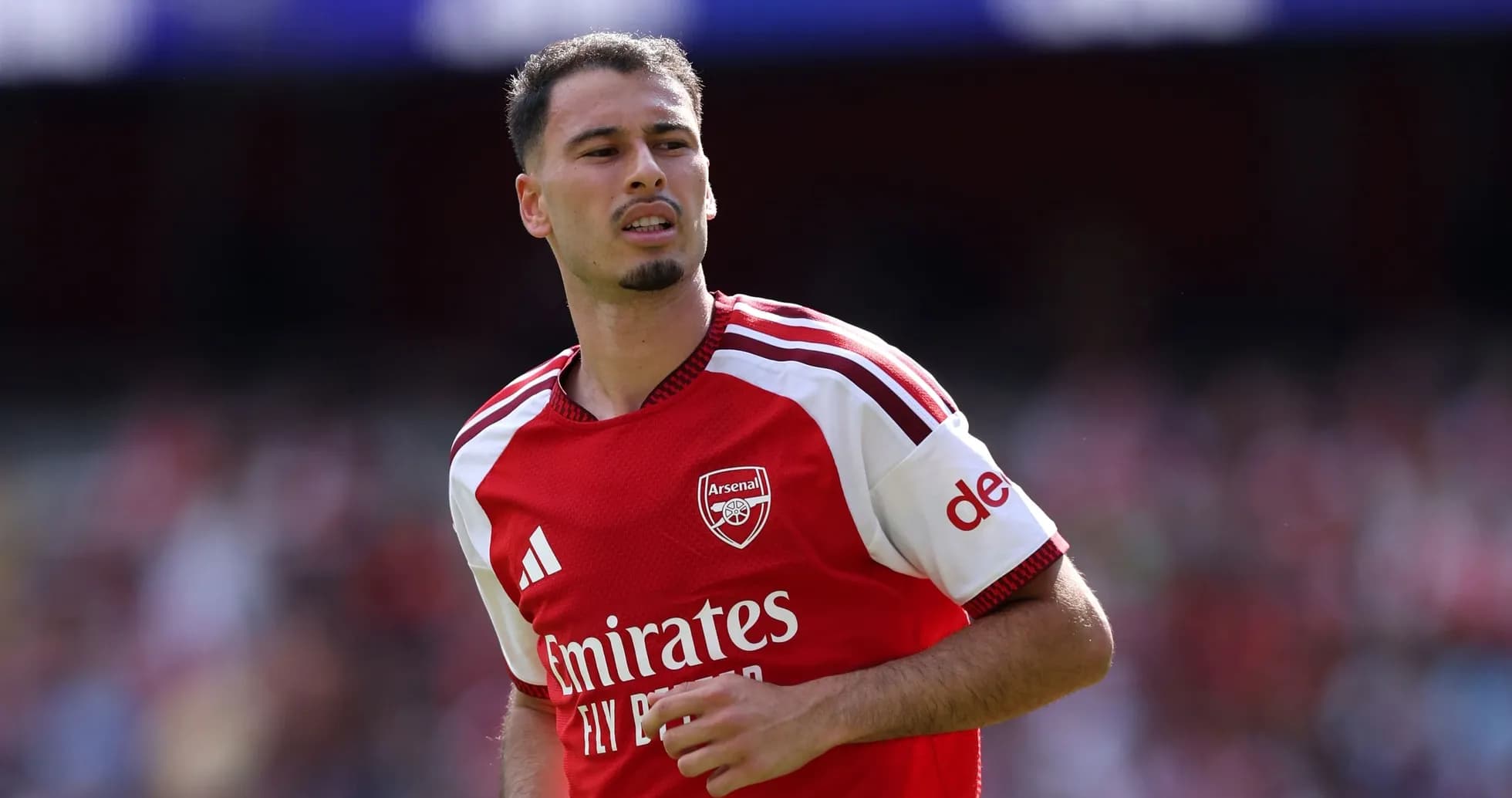 Arsenal player in red jersey during match