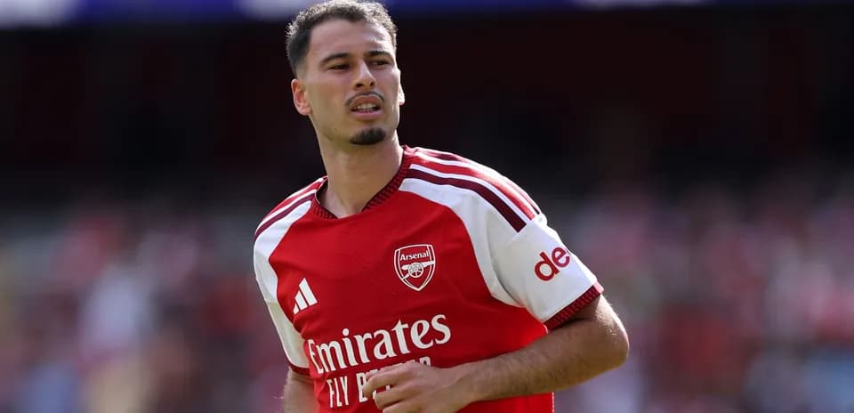 Arsenal player in red jersey during match