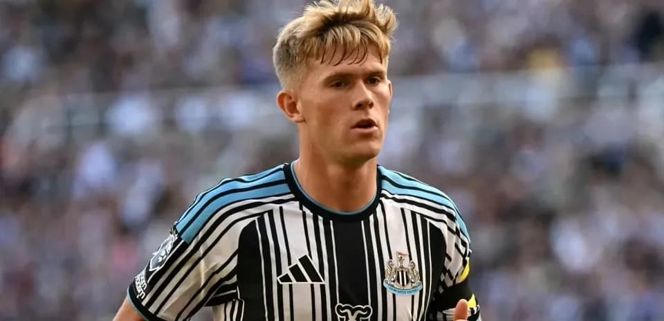 Newcastle player running on the field during match