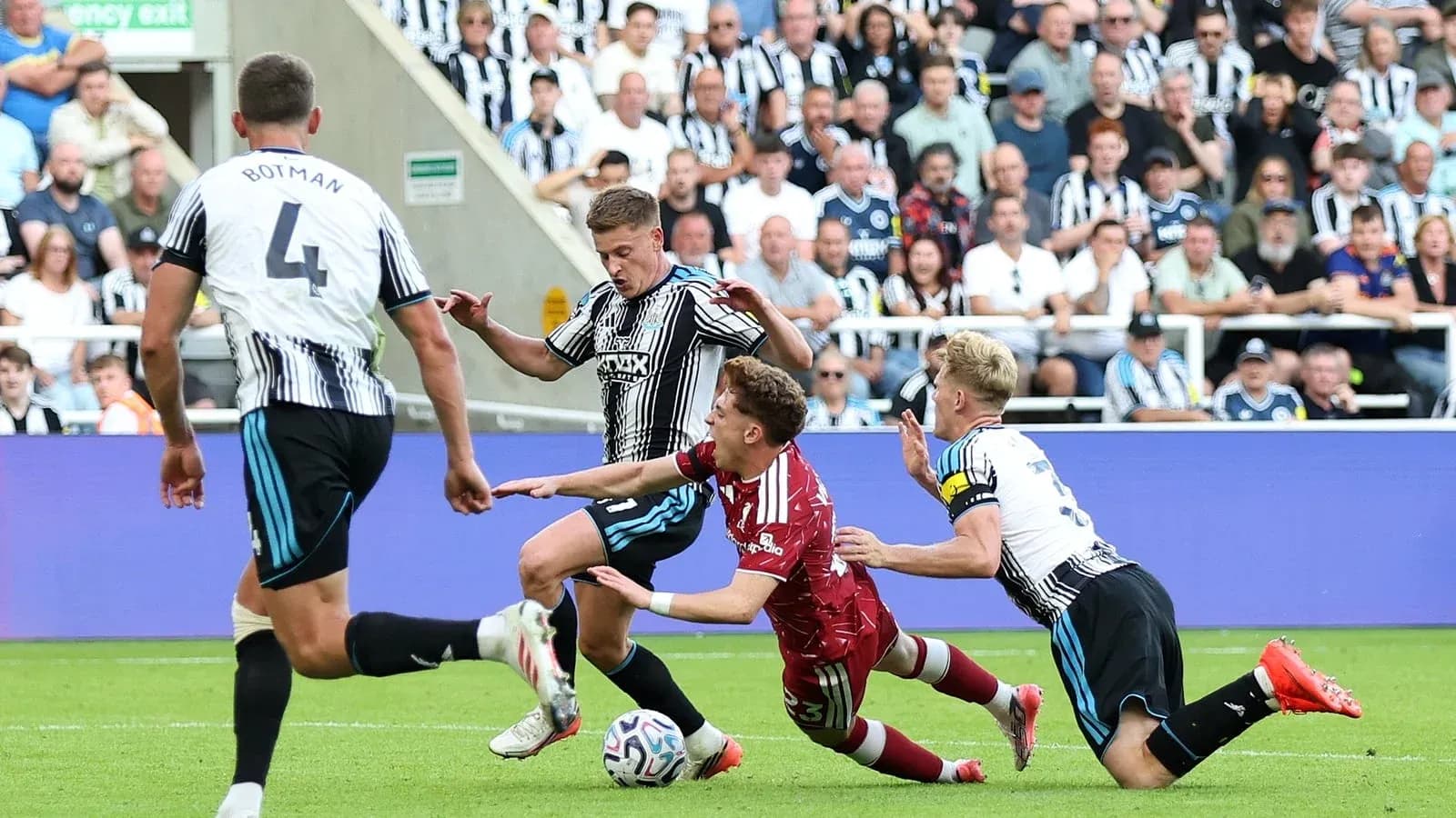 Players contesting for the ball on the field