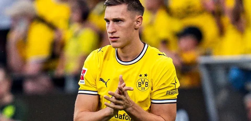 Player in yellow jersey clapping to fans