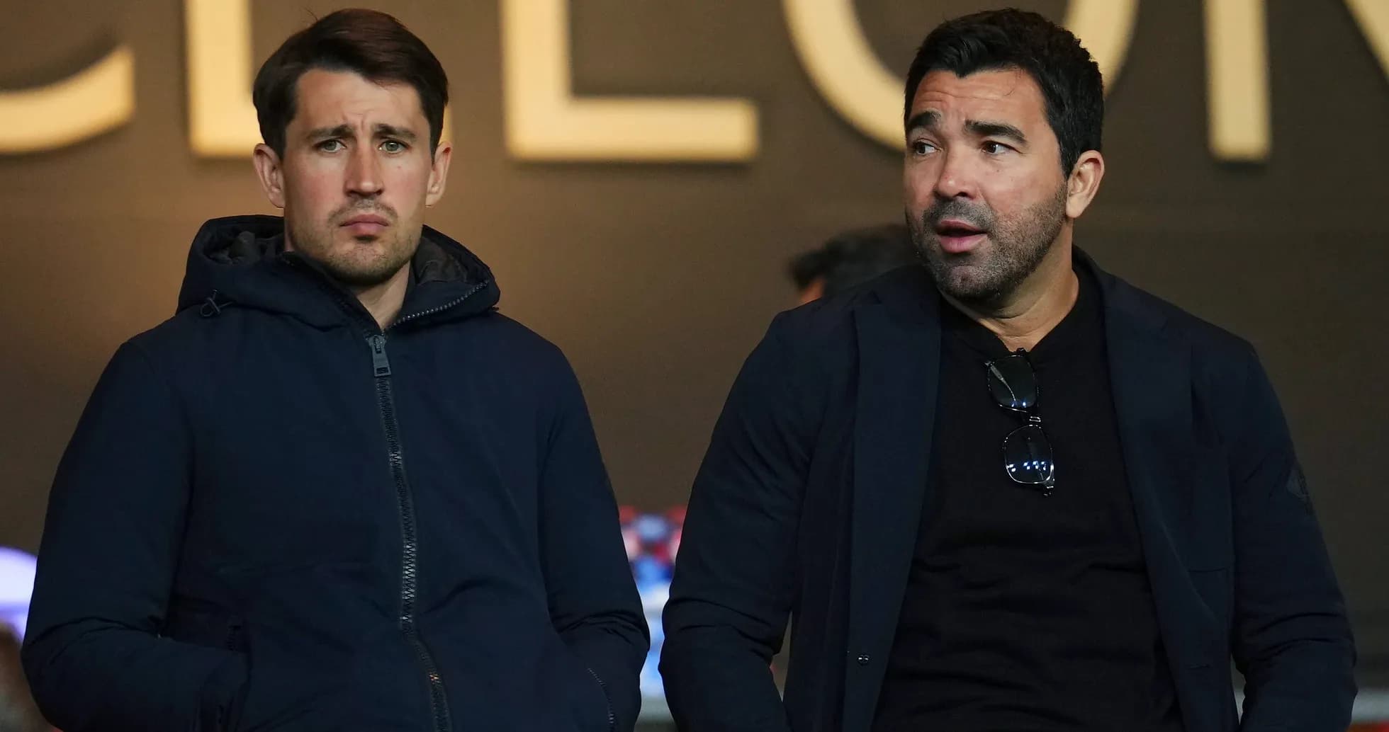 Two men sitting together in a stadium