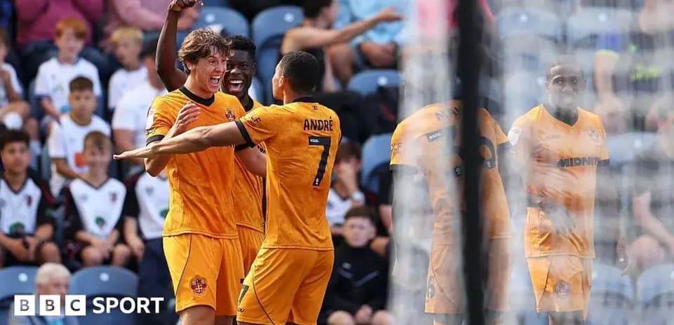 Players celebrating a goal during a match