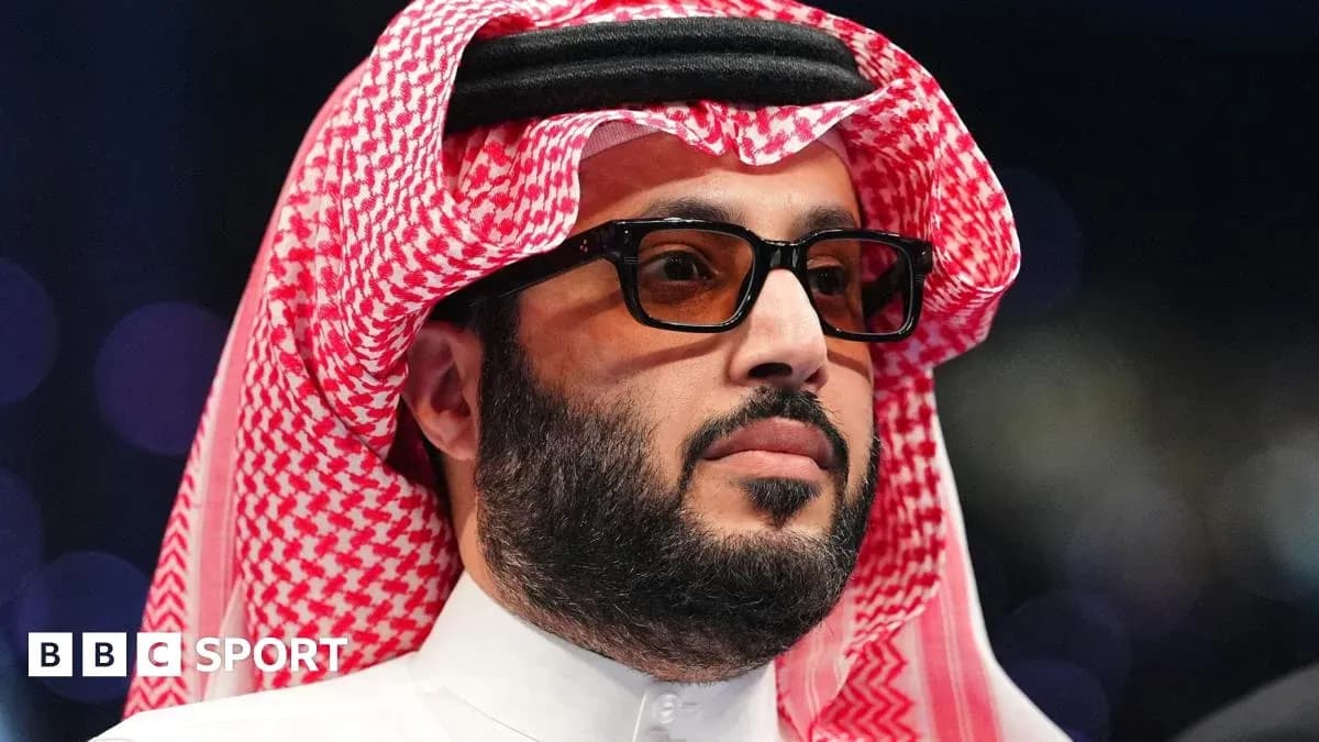 Man in traditional attire at a sporting event