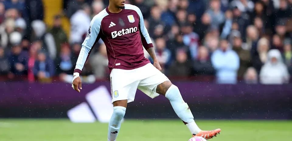 Player in Aston Villa kit preparing to pass ball