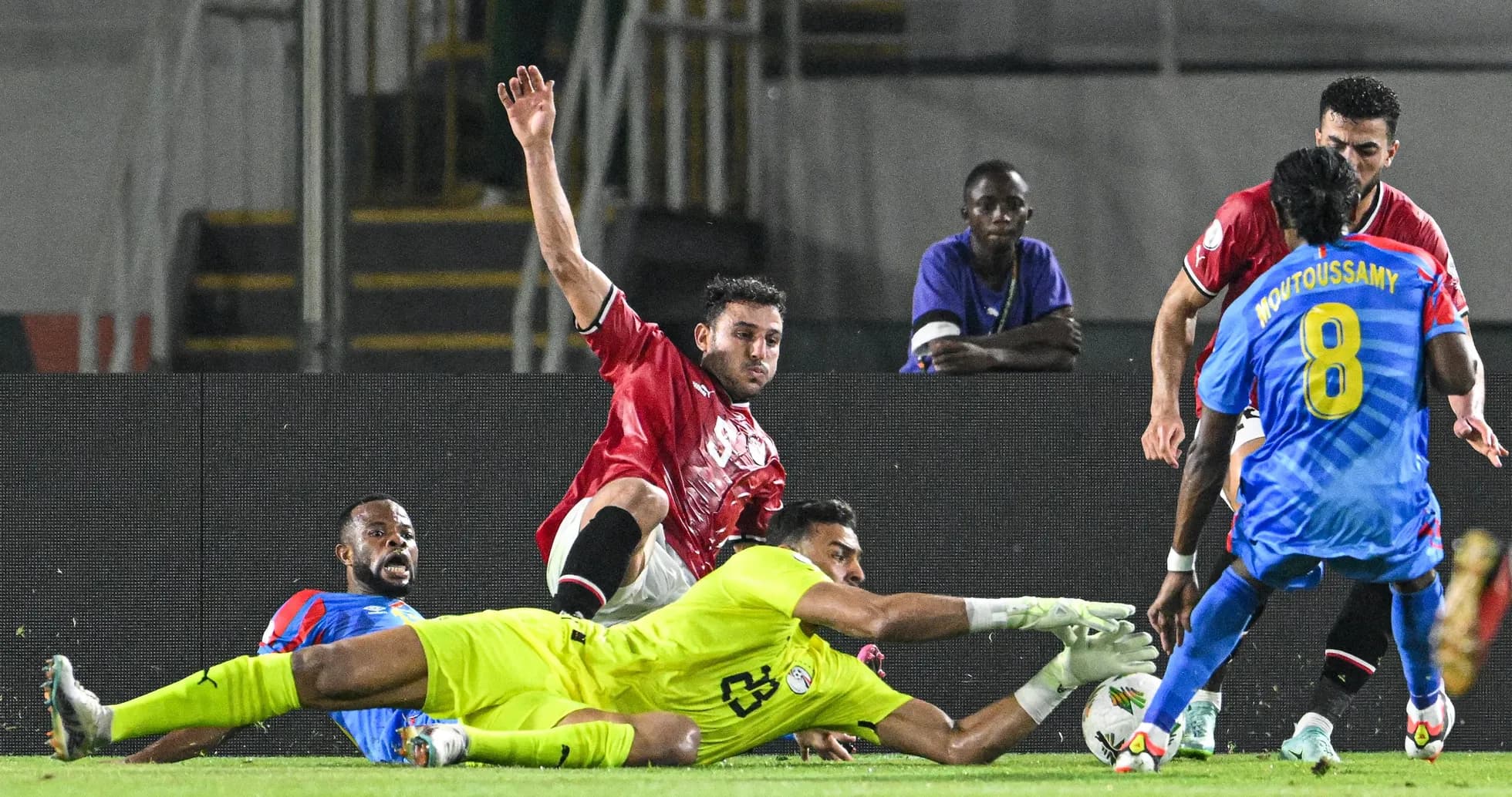 Players contesting for the ball near goal area