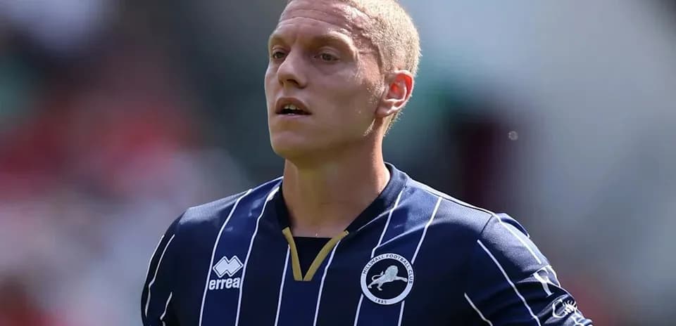 Player wearing Millwall FC jersey on the field