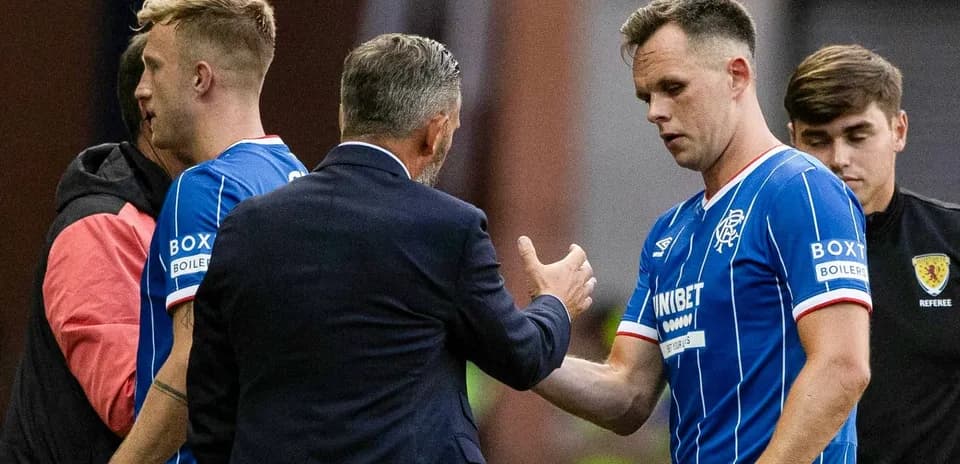 Rangers players receiving instructions from the manager