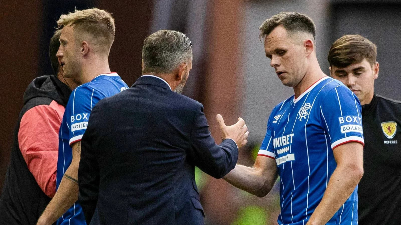 Rangers players receiving instructions from the manager