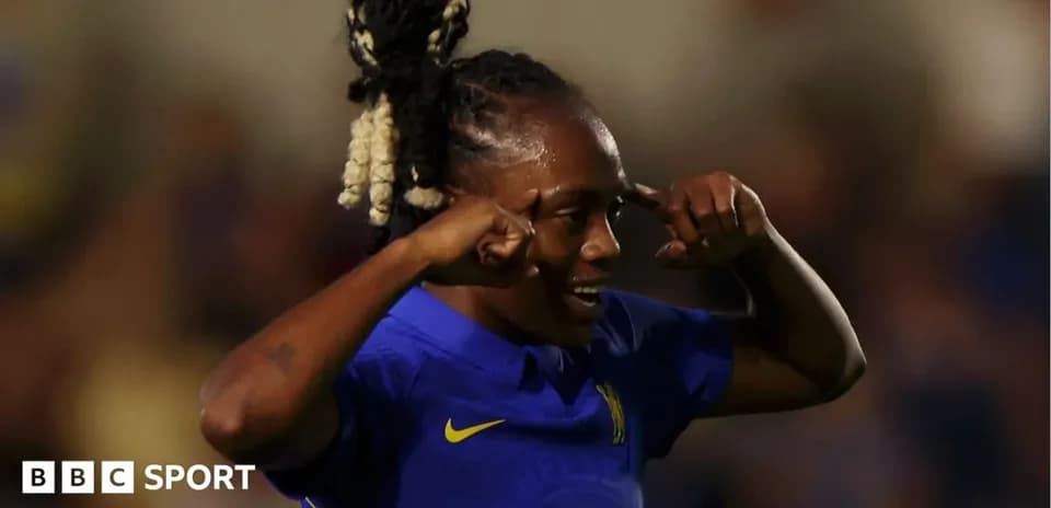 Player celebrating a goal with hand gestures