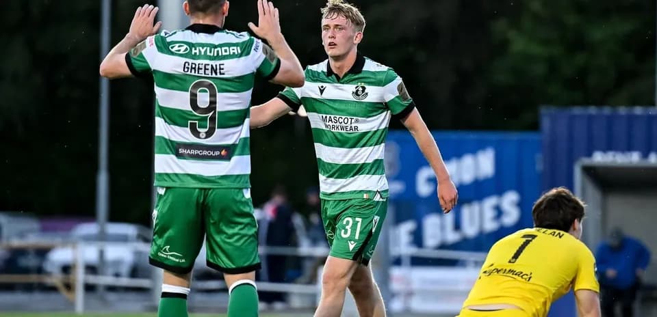 Two players celebrating a goal during a match
