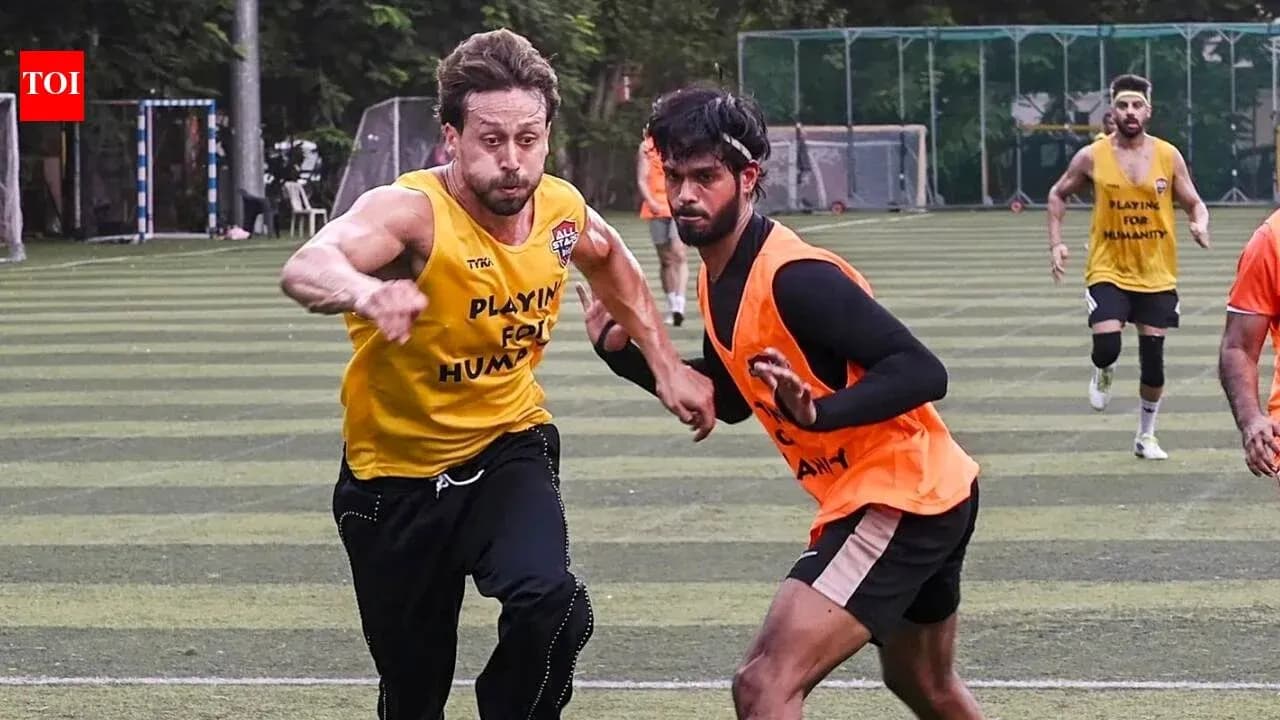 Two players sprinting during a football training session