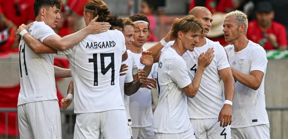Players celebrating after a goal during match