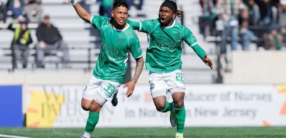 Players celebrating after scoring a goal