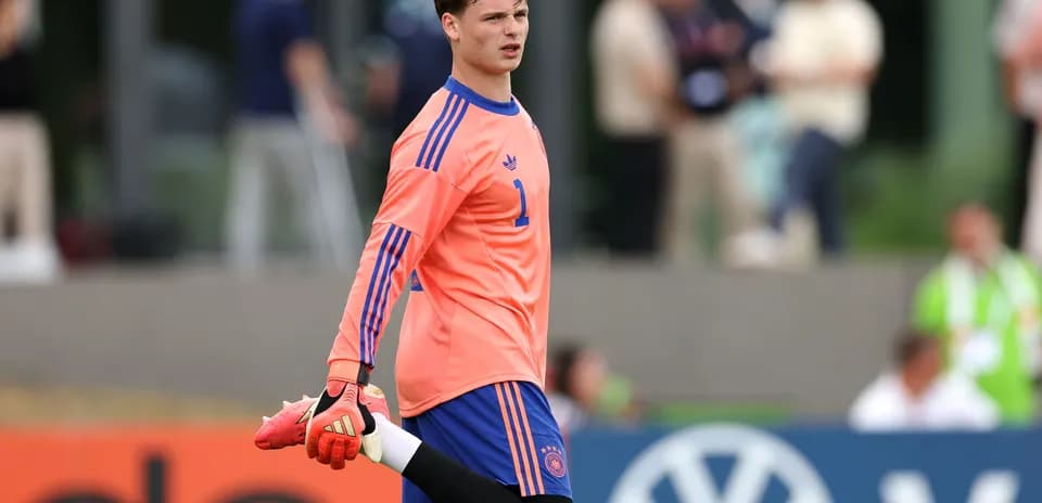 Goalkeeper stretching during warm-up session