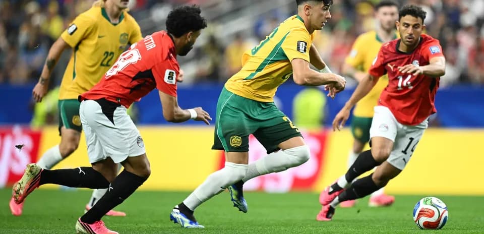 Australia players competing against Egypt in football match