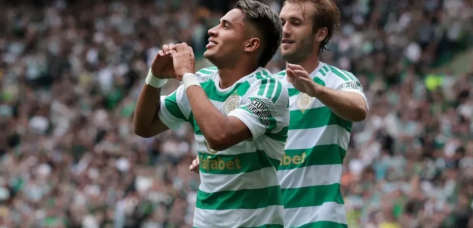 Celtic players celebrating a goal during a match
