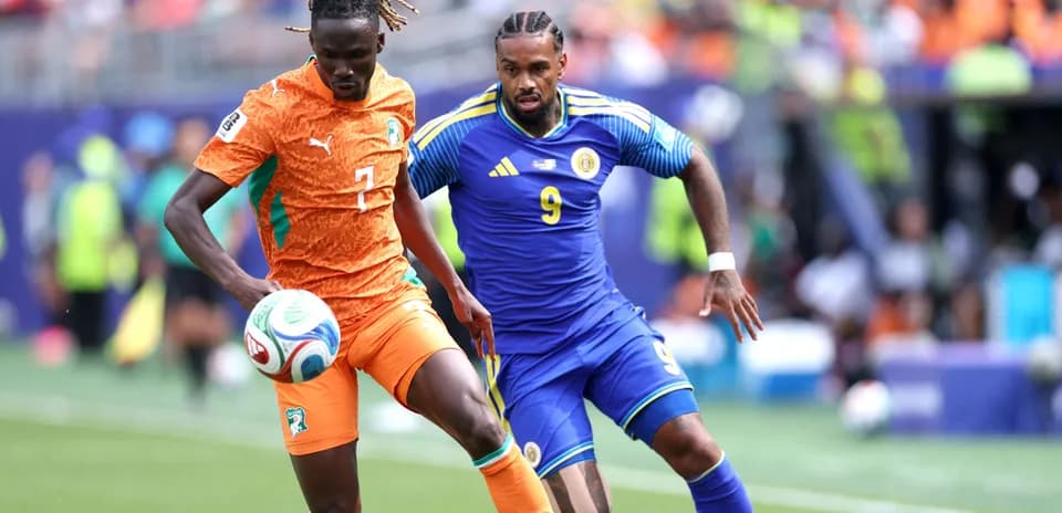 Two players contesting the ball during a match