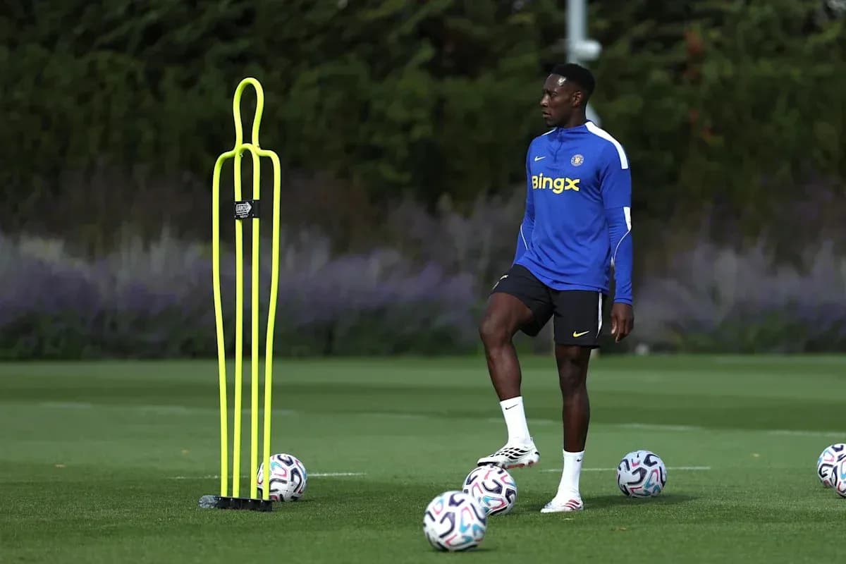 Player practicing near training mannequins and soccer balls