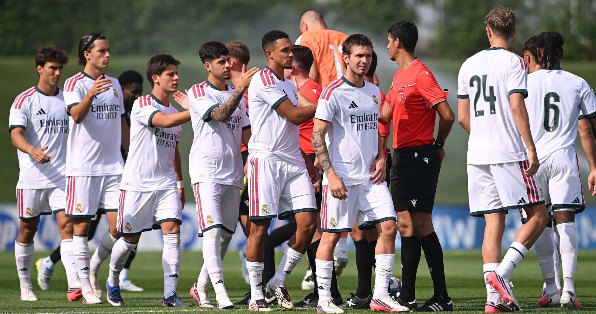 Real Madrid players greeting referee before match
